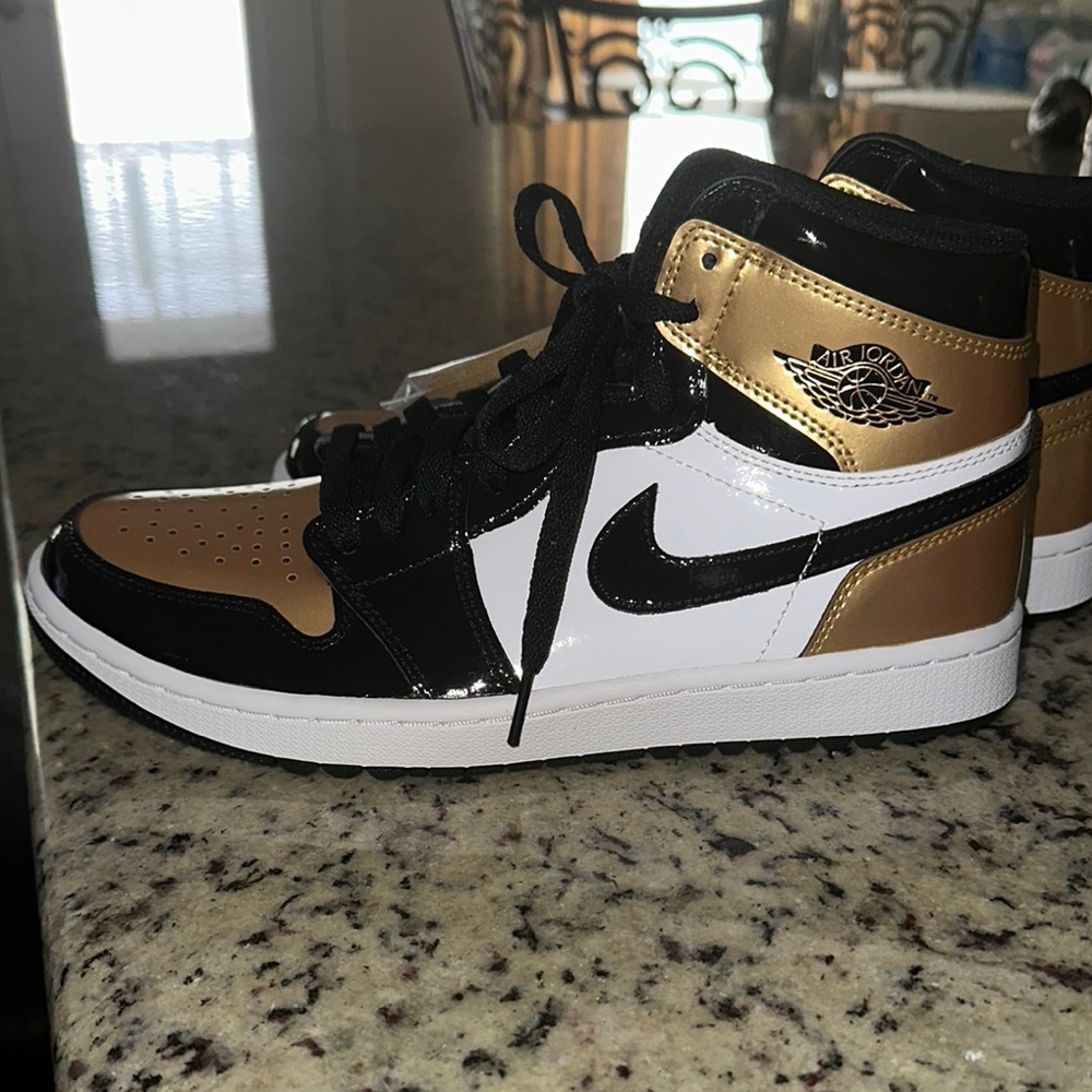 Jordan Black and Gold High-Top Sneakers